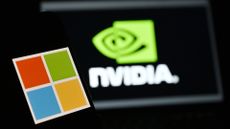 Microsoft logo pictured on a smartphone in foreground with Nvidia logo and branding in background on laptop screen.