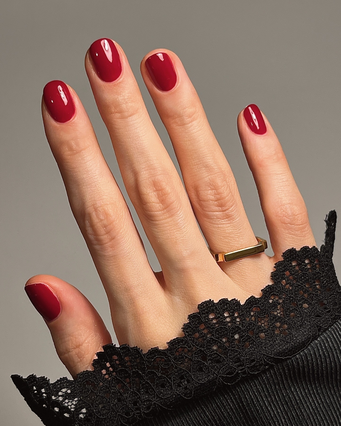 A picture of a short, oval-shaped manicure with the Essie Bubbles Only nail polish