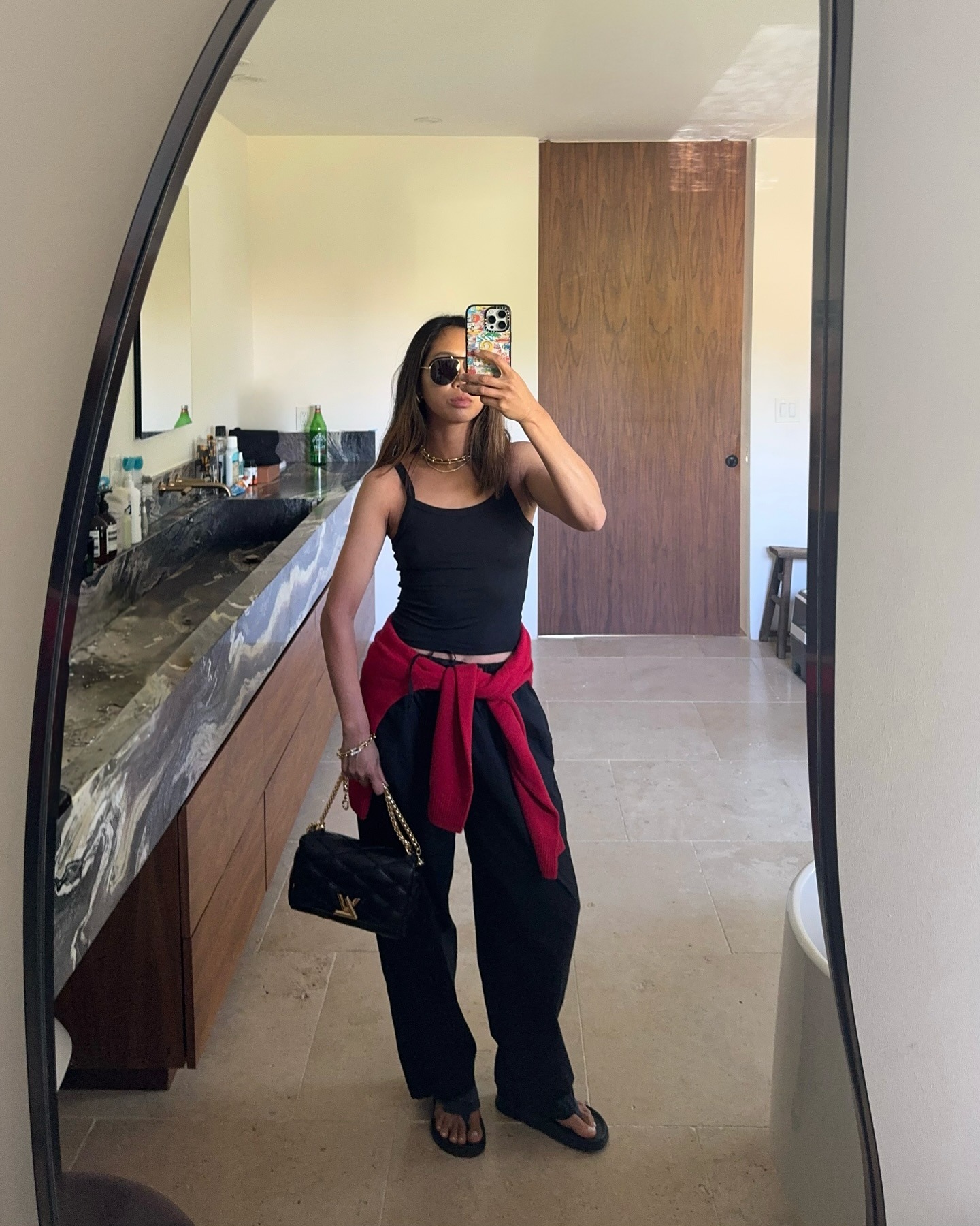 @aimeesong in a relaxed trousers and flip flops outfit for spring 2026