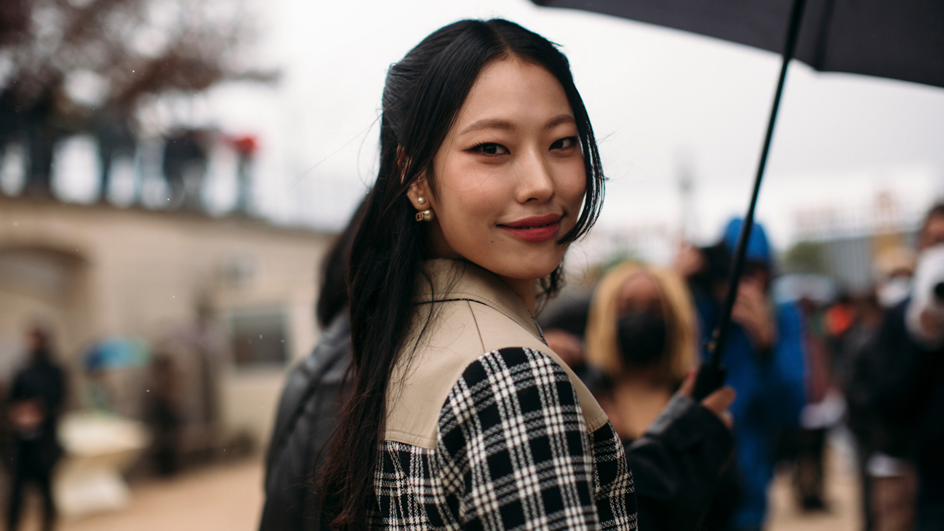 fashion week attendee wearing checked jacket