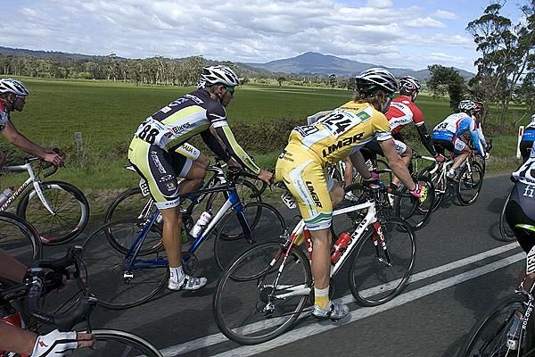 Ethan Kimmince (124) and James Hepburn (88) in the peloton as it rolls through on stage nine.