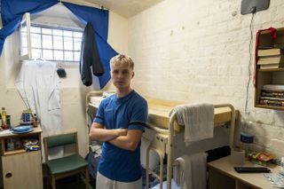 HRVY in a cell looking worried.