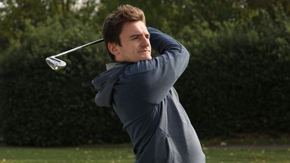 Adidas Go-To Primegreen Hoodie, man swinging in golf hoodie