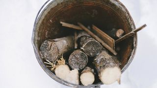 camping bucket ideas: firewood in a bucket