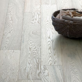 Hygena Soft White Engineered Wood Flooring with a wicker basket at the top right hand side of the image