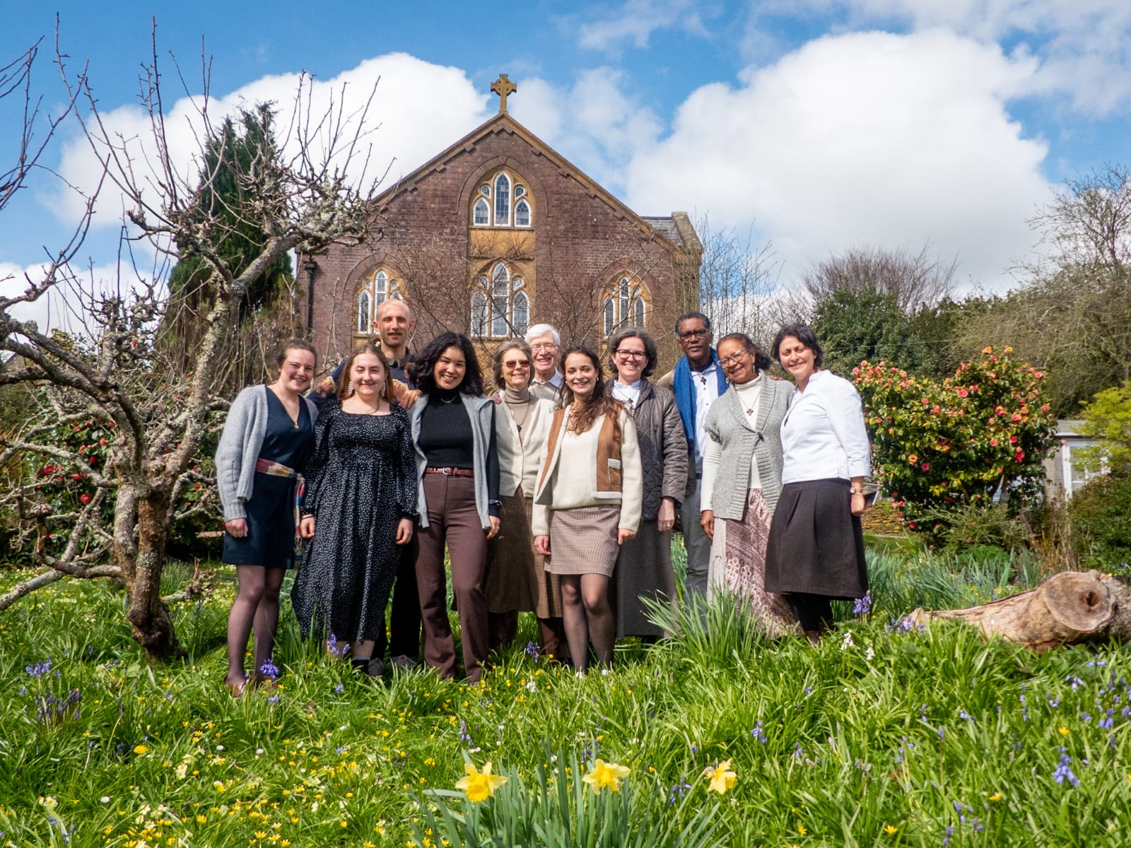 The team at the Chemin Neuf community stands outside the abbey