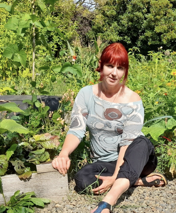 Kim Stoddart sitting in her garden
