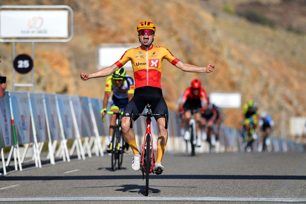 QURAYYAT OMAN FEBRUARY 12 Anthon Charmig of Denmark and UNO X Pro Cycling Team celebrates winning during the 11th Tour Of Oman 2022 Stage 3 a 180km stage from Sultan Qaboos University to Qurayyat 240m TourofOman on February 12 2022 in Qurayyat Oman Photo by Dario BelingheriGetty Images