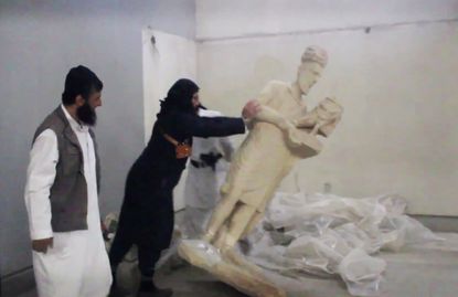 ISIS destroys priceless artifacts in a Mosul museum