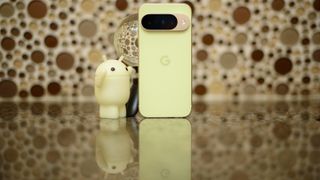 Google Pixel 10 in Lemongrass against a bubbly backsplash
