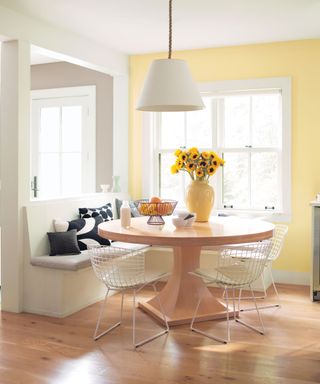 Breakfast nook with a yellow accent wall