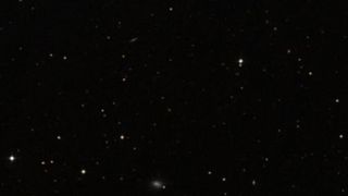 An image of stars in deep space as white dots against a black background