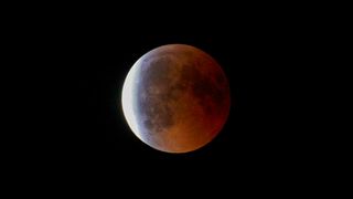 Partial lunar eclipse, red moon