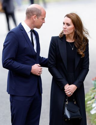 Prince William touches the small of Kate Middleton's back