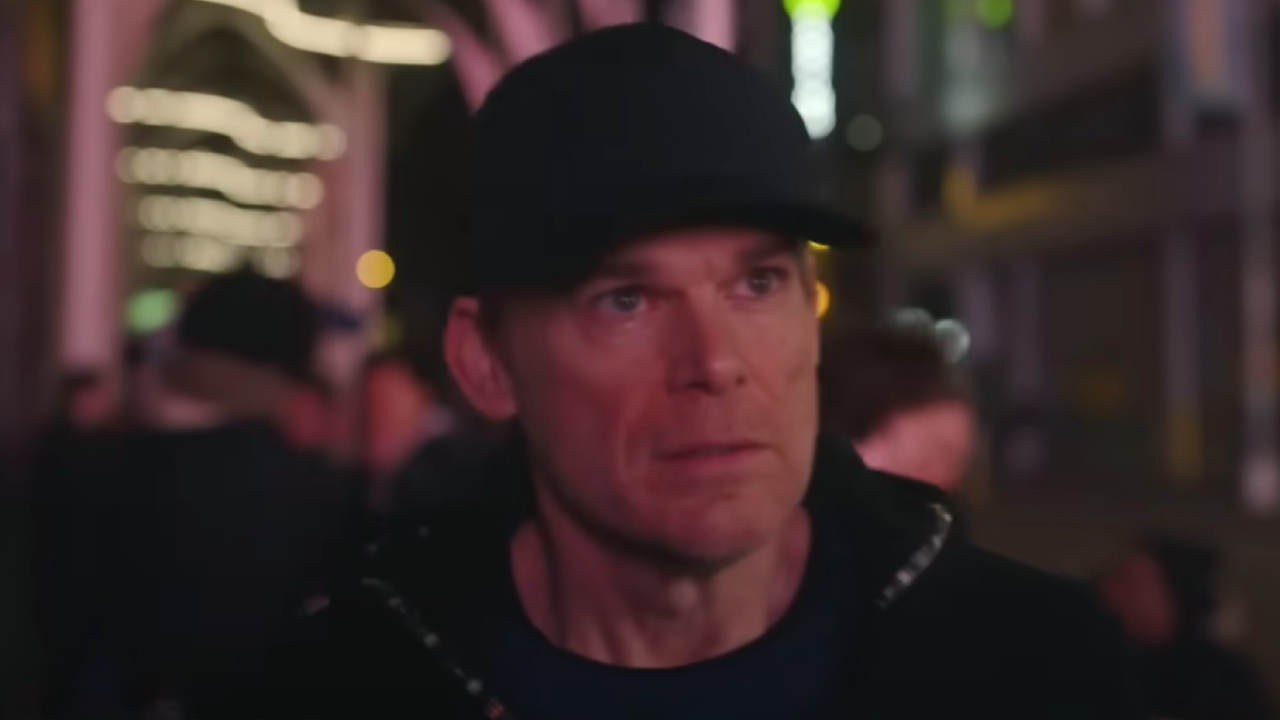 Michael C. Hall walking through New York City in a baseball cap on Dexter: Resurrection