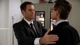Tony DiNozzo pressing his hands against the top of Jimmy Palmer's arms in NCIS