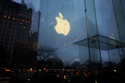 Apple's logo through rainy windows