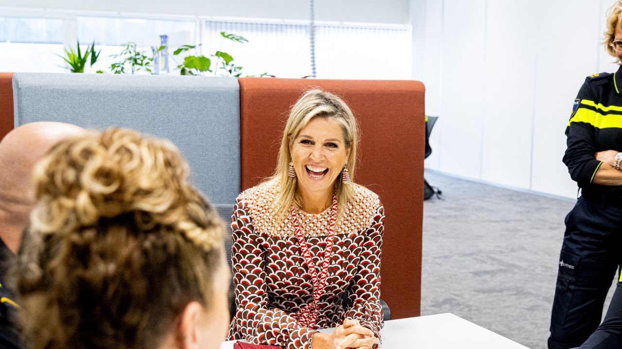 Queen Maxima&#039;s autumnal dress and red accessories made a statement as the royal stepped out for two important engagements in Amsterdam