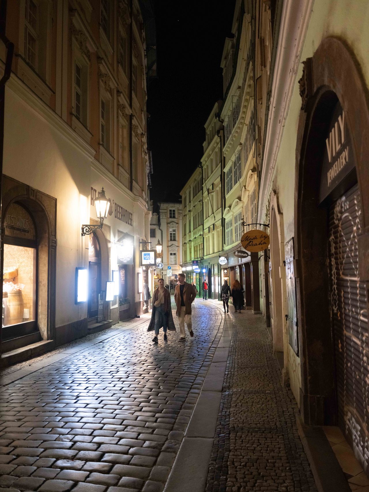 A street in Prague lit up at night