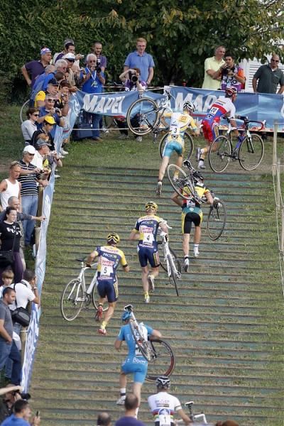Several riders climbing the Treviso stairs.