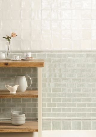 traditional inspired kitchen with light green and white subway tiles