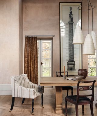 dining room with classical furniture and artwork and a contemporary pendant chandelier