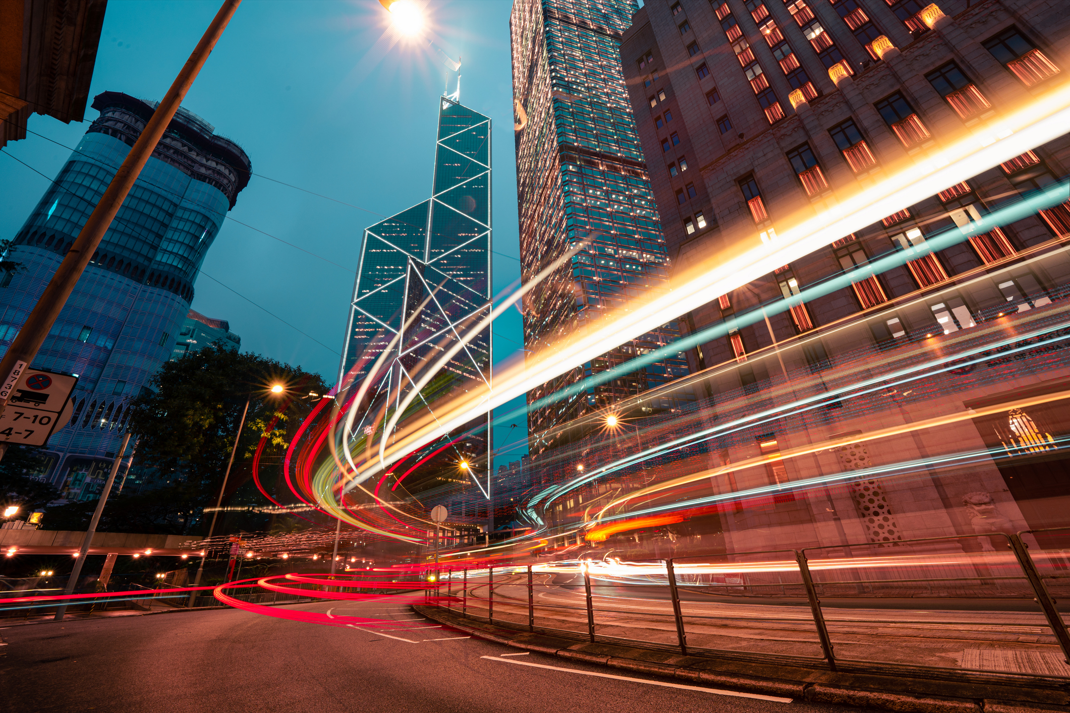 Hong Kong's downtown auto trails with light streaks representing momentum investing