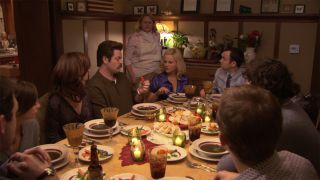 Leslie Knope (Amy Poehler) at a dinner with friends in Parks and Recreation