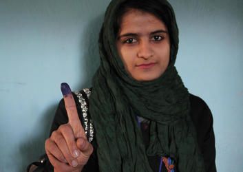 Facing violence and threats from the Taliban, Afghan voters still turn out