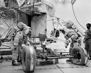 Eugene A. Cernan and Harrison H. Schmitt inspect a LRV trainer. The two wheels at the front appear deflated.