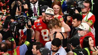 Taylor Swift and Travis Kelce hug after the Kansas City Chiefs' Super Bowl victory