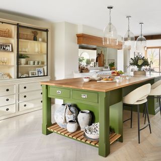 country style kitchen with green island unit with breakfast bar