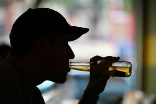 Man drinking beer at a bar