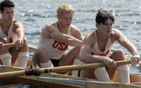 From left to right: Shorty Hunt (Bruce Herbelin-Earle), Joe Rantz (Callum Turner), and Don Hume (Jack Mulhern) rowing in The Boys in the Boat