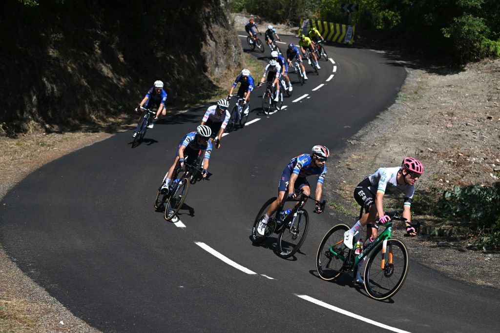 PUERTO DE ANCARES SPAIN AUGUST 30 LR Mikel Landa of Spain and Team TRex Quick Step Darren Rafferty of Ireland and Team EF Education EasyPost and a general view of the peloton competing during the La Vuelta 79th Tour of Spain 2024 Stage 13 a 176km stage from Lugo to Puerto de Ancares 1659m UCIWT on August 30 2024 in Puerto de Ancares Spain Photo by Dario BelingheriGetty Images