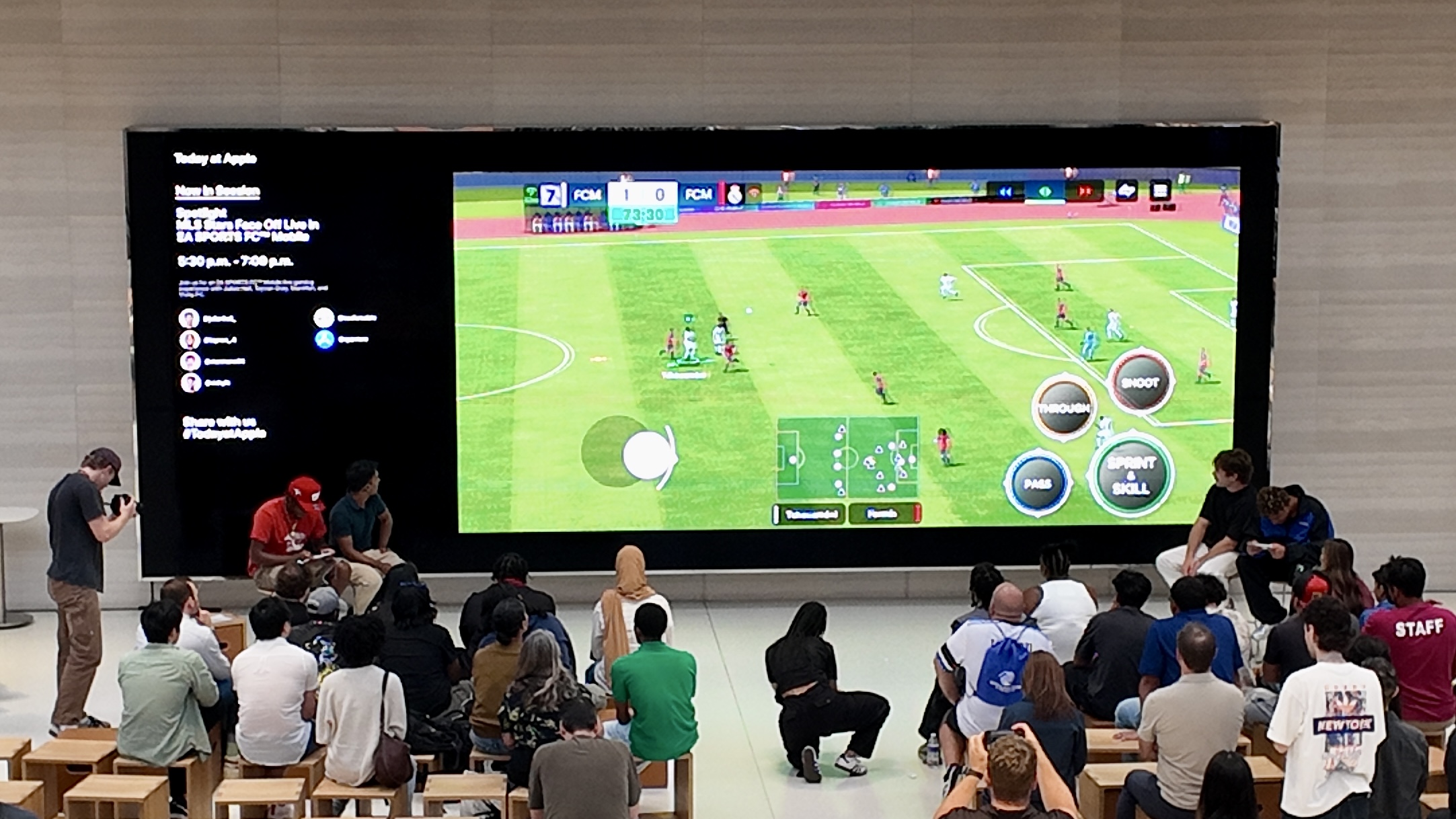 FC Mobile match on screen inside Apple Store