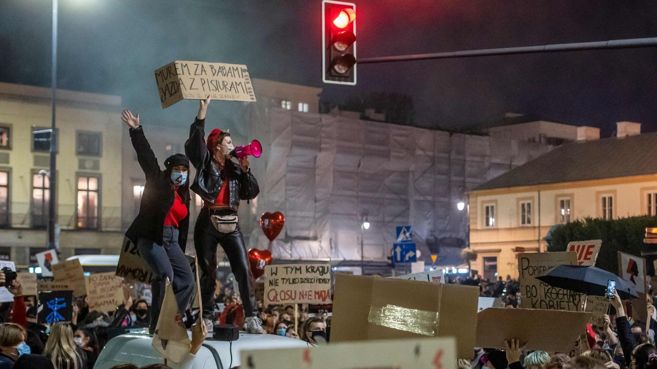 Protesters block traffic in the centre of Warsaw during a protest against a decision by the Constitutional Court on abortion