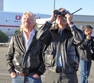 Burt Rutan of Scaled Composites and Sir Richard Branson of Virgin Galactic watch the first solo test glide test of SpaceShipTwo on Oct. 10, 2010.