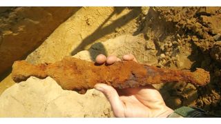 When it was first discovered, the corroded dagger and sheath looked like a chicken tender.