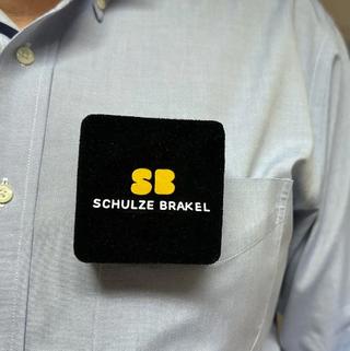 Schulze-Brakel's SchulzClip on a man's light blue shirt
