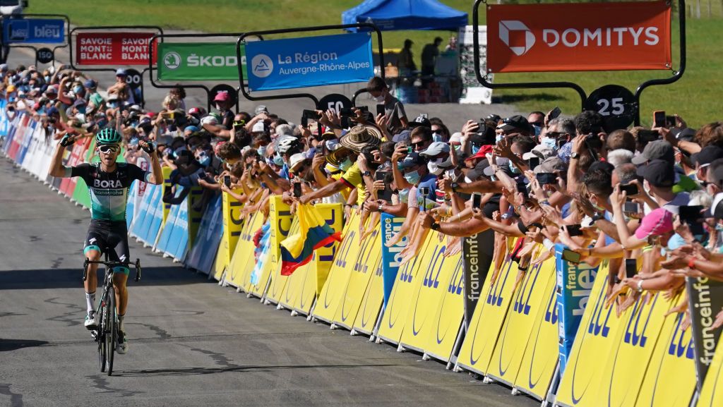 Team Bora rider Germanys Lennard Kamna celebrates as he crosses the finish line at the end of the fourth stage of the 72nd edition of the Criterium du Dauphine cycling race 153 km between Ugine and Megeve on August 15 2020 Photo by EDDY LEMAISTRE POOL AFP Photo by EDDY LEMAISTREPOOLAFP via Getty Images