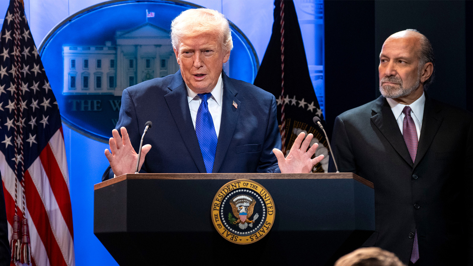 Trump and Lutnick together at a podium.