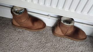 Ugg boots drying under radiator
