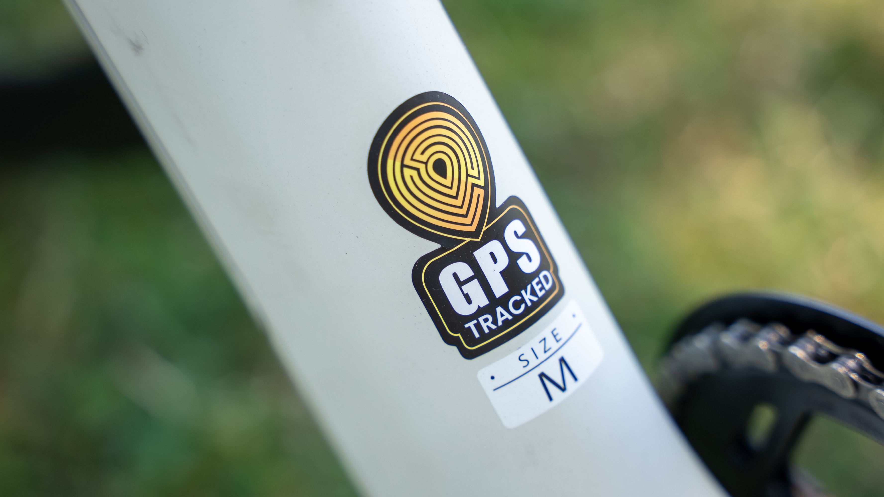 The frame of the Urtopia Carbon 1 Pro electric bike with the GPS Tracked label