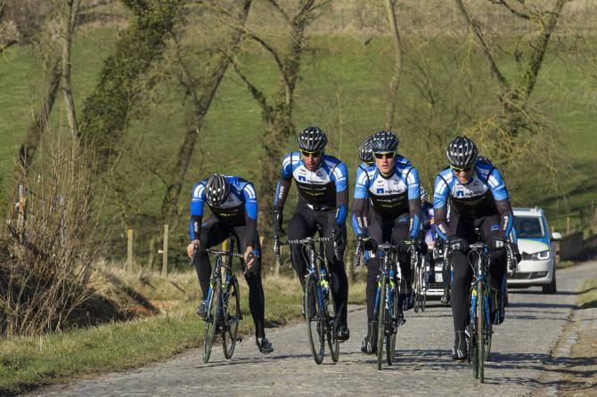 A NetApp-Endura rider comes to grief on a sector of cobbles.