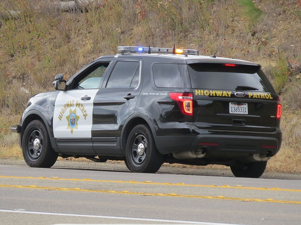 Drivers gather spilled bills from California freeway after armored car ...