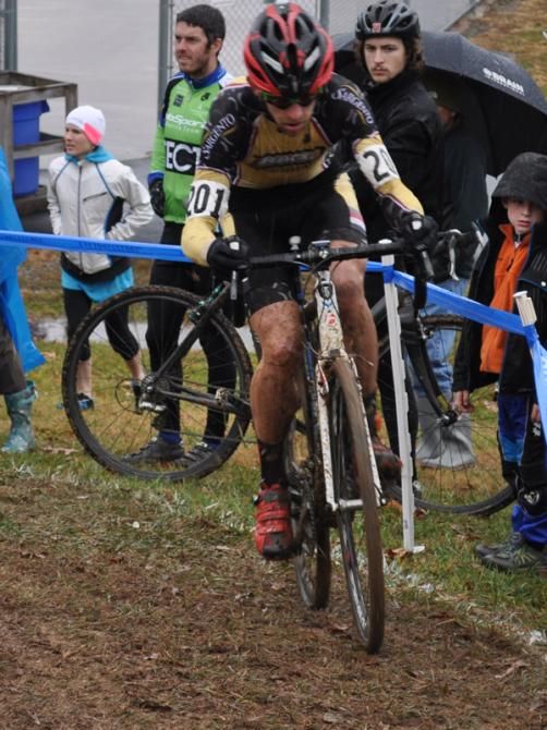 Brian Matter (RACC p/b Geargrinder) hugs the course tape through the off-camber section