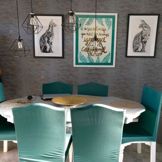 dining room with green chairs