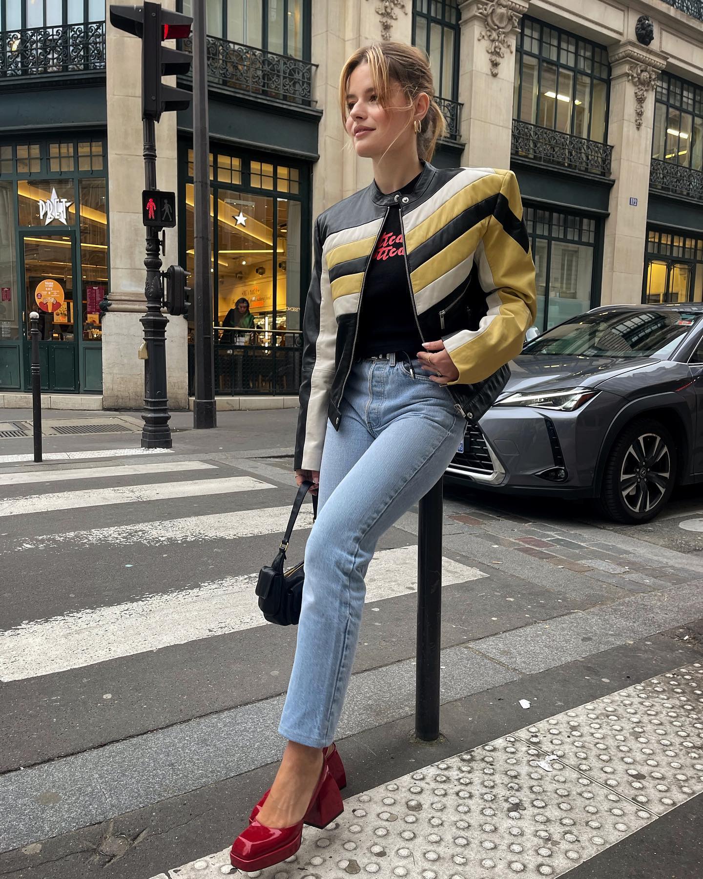 Sabina Socol wearing red shoes in Paris.