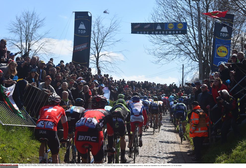 The peloton make their way up the climb